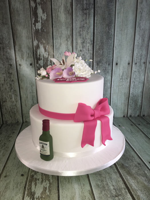 2 tier birthday cake with sugar bow