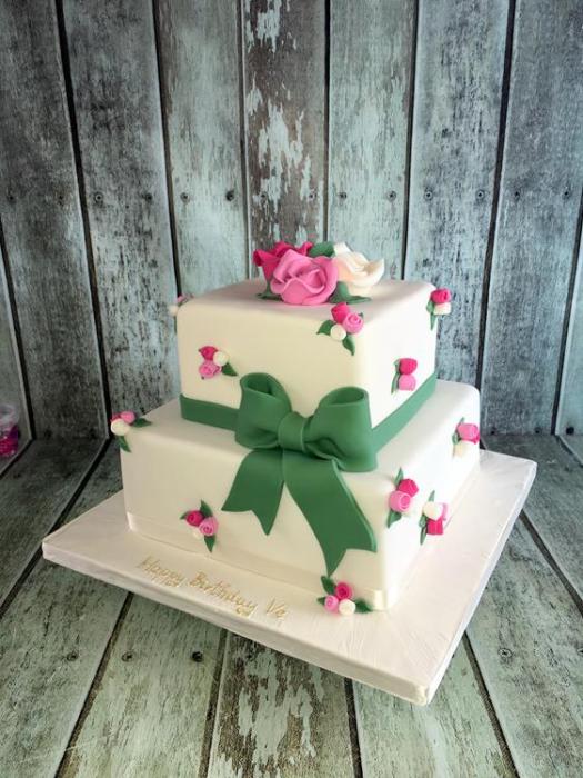 pretty vintage birthday cake with flowers and sugar bow