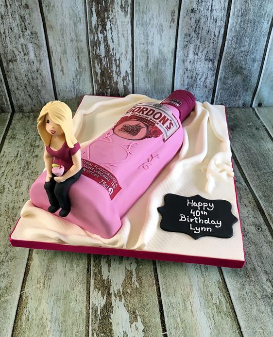 pink gin birthday cake with sugar figure