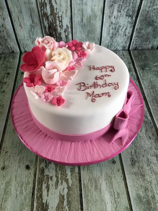 birthday cake with  pink sugar roses and bow