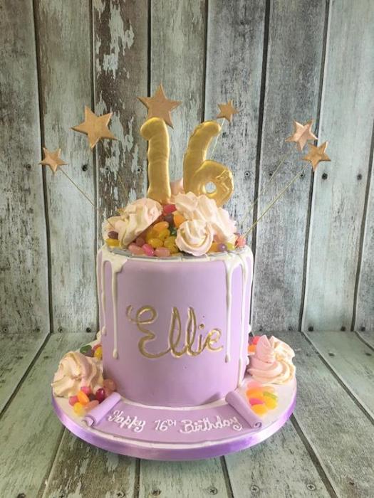 sweet 16 drip birthday cake with sweets andmerangues