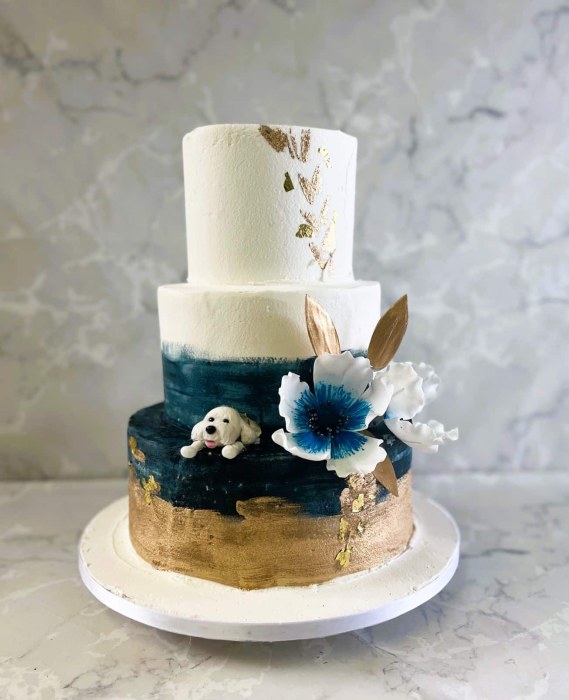 Hand painted colourwash buttercream  wedding cake with gold painting and water Lilly