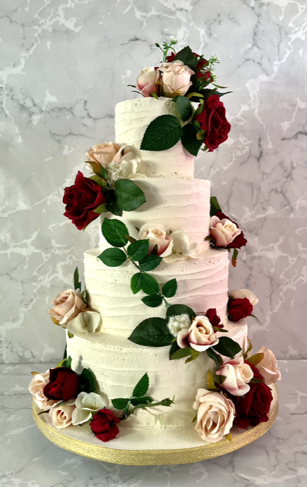 silk-flowers-on-a-vine-on-a-buttercream-wedding-cake-