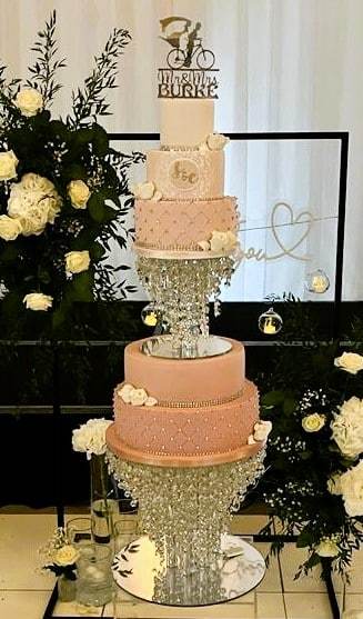 Ombre-pink-wedding-cake-with-diamante-and-sugar-roses-on-a-crystal-stand-