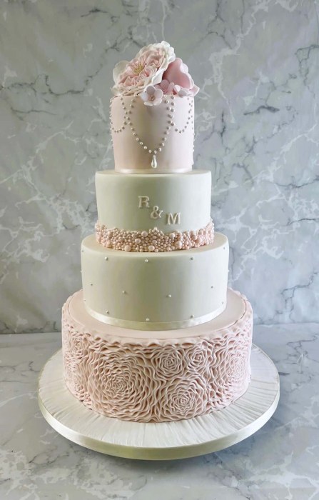 pale-pink-rosettes-wedding-cake-and-pearl-necklace